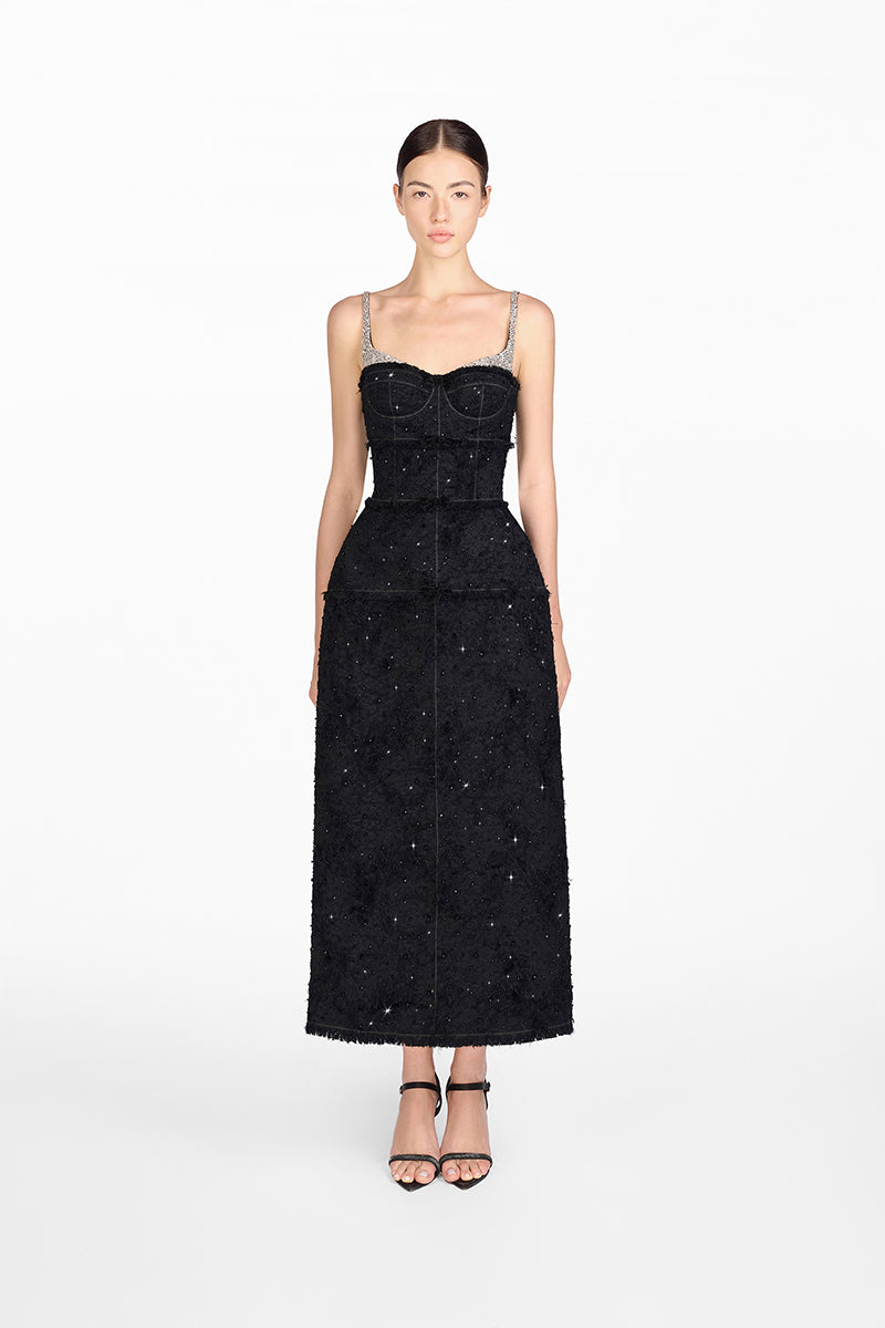 Black dress with silver embellishments on a white background