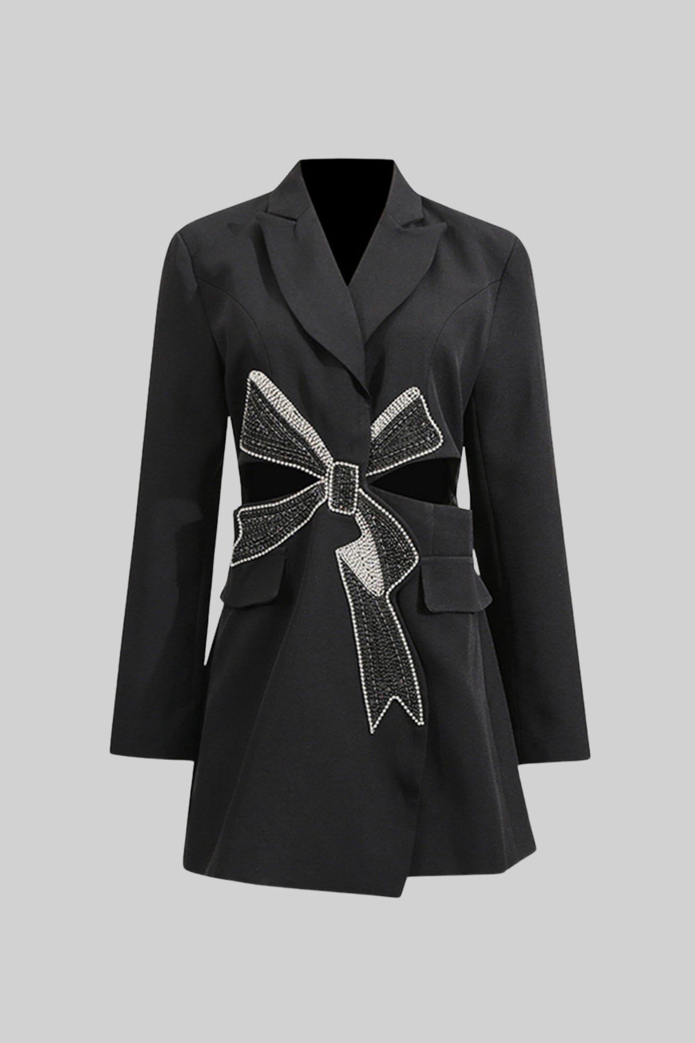 Black coat with a decorative bow on a gray background
