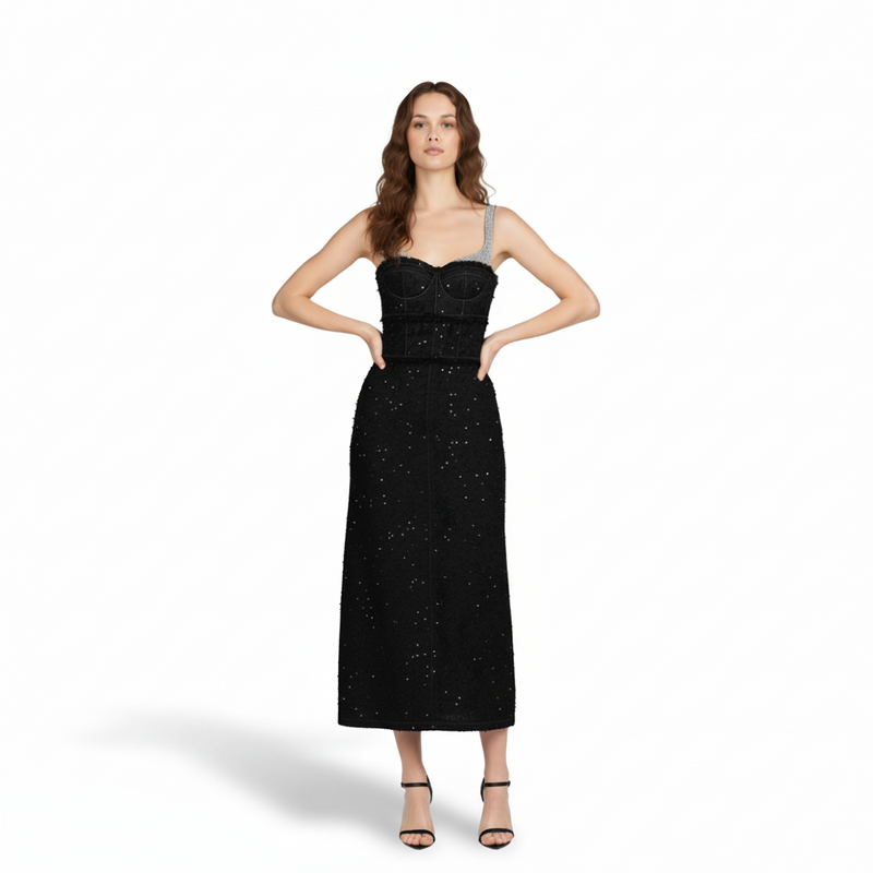 Woman wearing a black sequin dress on a white background