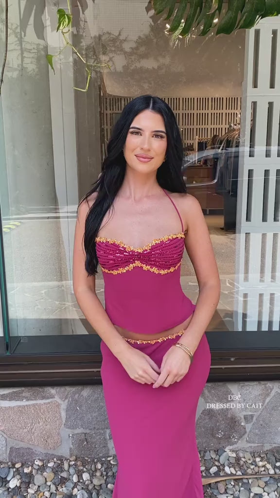 Woman in a magenta halter maxi dress with gold trim, styling video, VeroMarka