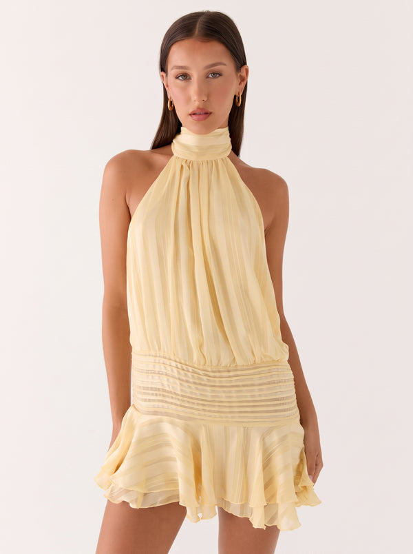 Backless Halter Ruffle Mini Dress in buttermilk yellow, closer front view on model, VeroMarka