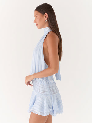 Backless Halter Ruffle Mini Dress in powder blue, side view on model, VeroMarka