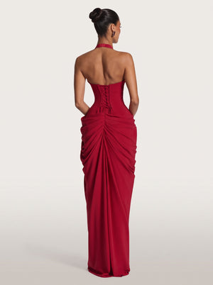 Draped Halter Slit Gown in red — plunging halter, corset back and draped slit skirt, back view on model, VeroMarka