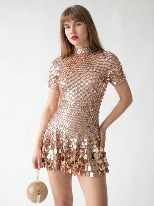ÉclatShell Sequin Mock-Neck Mini Dress in rose gold — mock neck and sequin disc skirt, closer front view on model, VeroMarka
