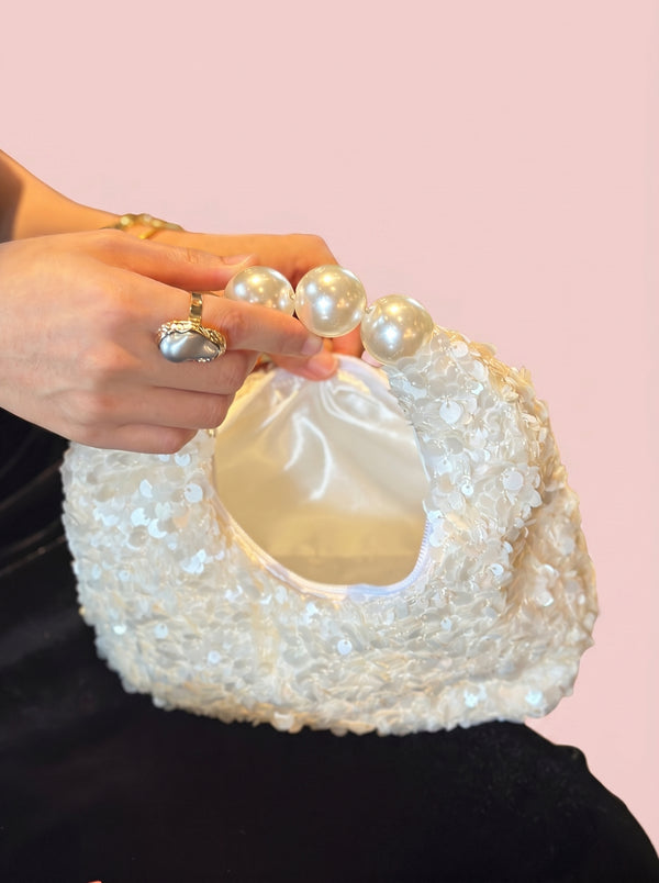 Pearl Handle Sequin Bag in white — sequin finish and pearl handle, close-up of the pearl handle and lining, VeroMarka