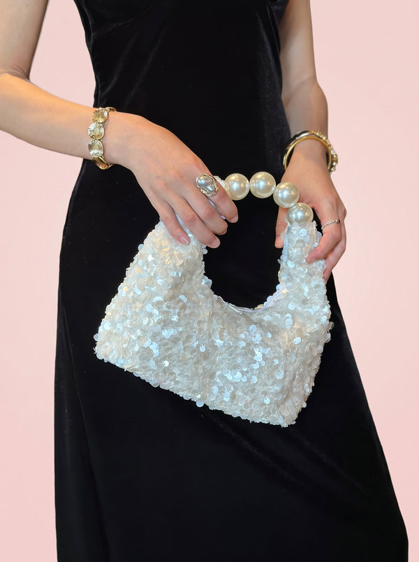 Pearl Handle Sequin Bag in white — sequin finish and pearl handle, held by the pearl handle, VeroMarka