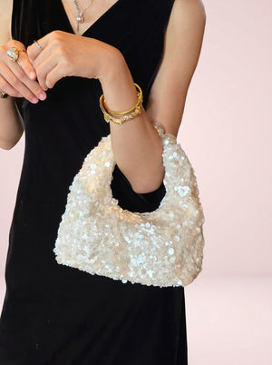 Pearl Handle Sequin Bag in white — sequin finish and pearl handle, held on the forearm, VeroMarka
