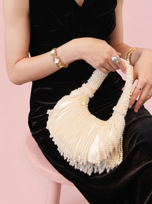 Pearl Tassel Underarm Bag in ivory pearl — beaded pearl handle and pearl tassel fringe, held while seated, VeroMarka
