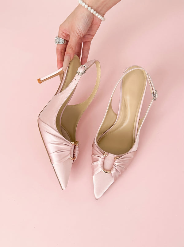 Pointed Toe Slingback Stiletto in blush pink — satin knot toe and ring detail, held in hand, VeroMarka