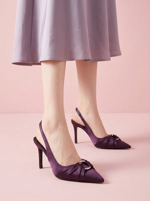 Pointed Toe Slingback Stiletto in purple — satin knot toe and ring detail, worn standing in a satin skirt, VeroMarka