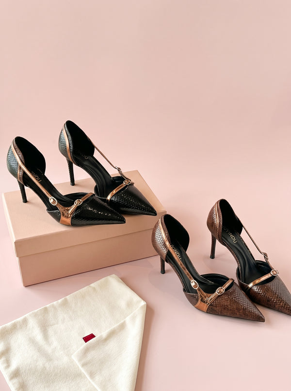 Pointed Toe Stiletto Heel in bronze brown and black, flat lay of black and brown pairs on a pink backdrop, VeroMarka