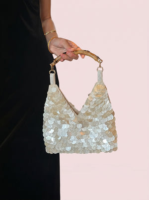 Sequin Bamboo Handle Hobo in ivory — shimmering sequins and bamboo handle, held by the bamboo handle, VeroMarka
