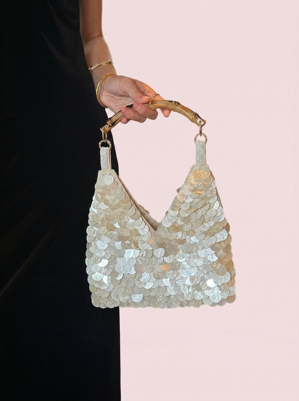 Sequin Bamboo Handle Hobo in ivory — shimmering sequins and bamboo handle, held by the bamboo handle, VeroMarka