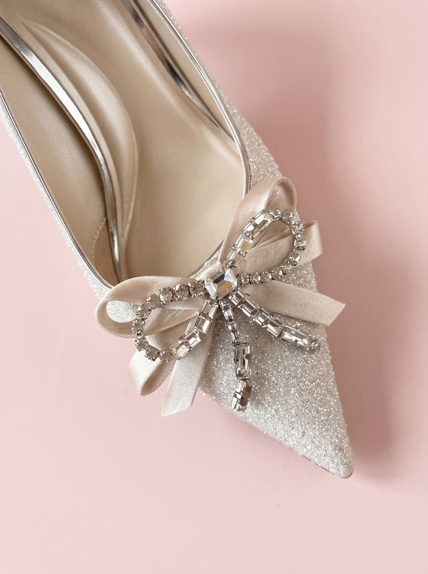Sequin Bow Stiletto Heel in silver — crystal bow and glitter finish, close-up of the crystal bow, VeroMarka