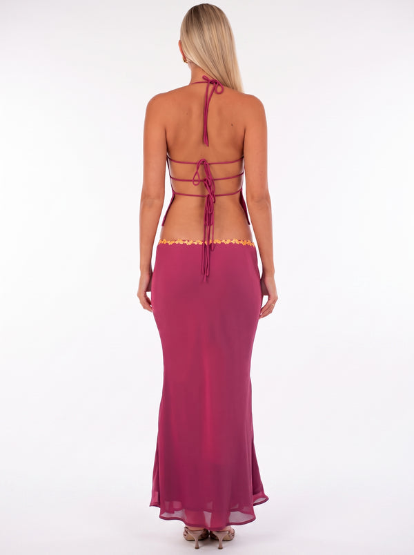 Sequin Floral Halter Set in fuchsia pink — sequin halter top with floral trim and maxi skirt, back view on model, VeroMarka